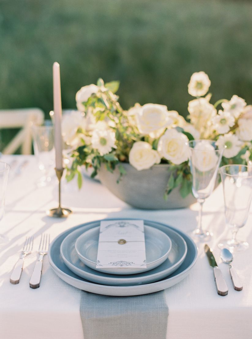 wedding shoot table, plating, silverware, and flowers