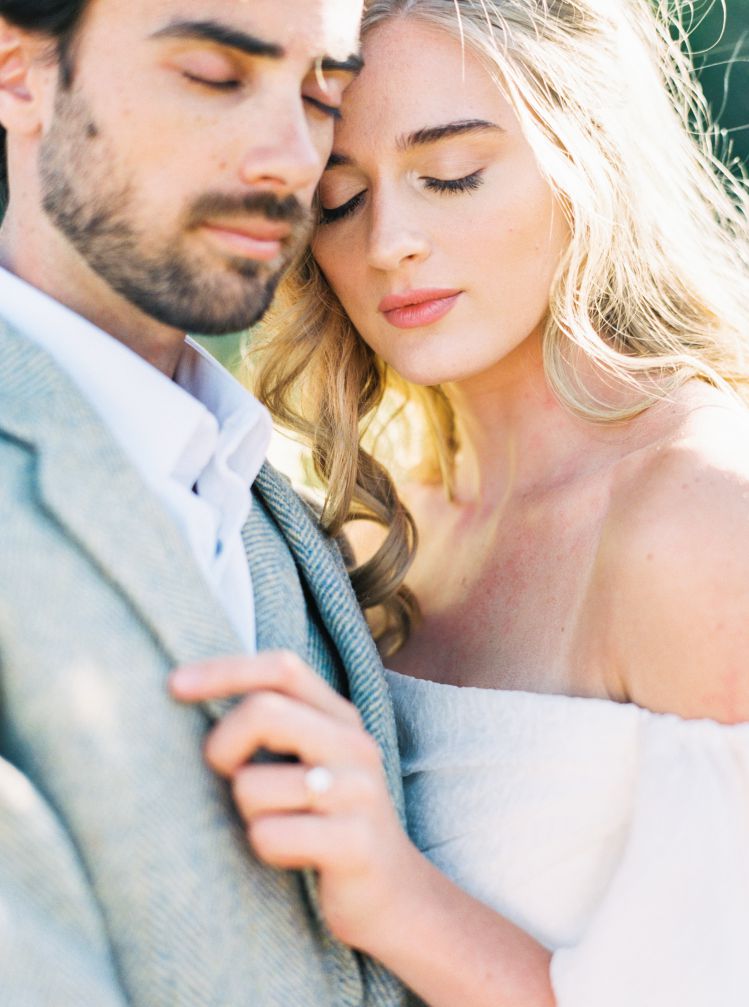 close up of groom and bride with natural makeup, red lipstick