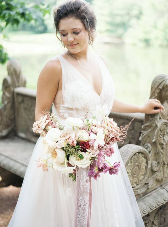bride holding bouquet and smiling