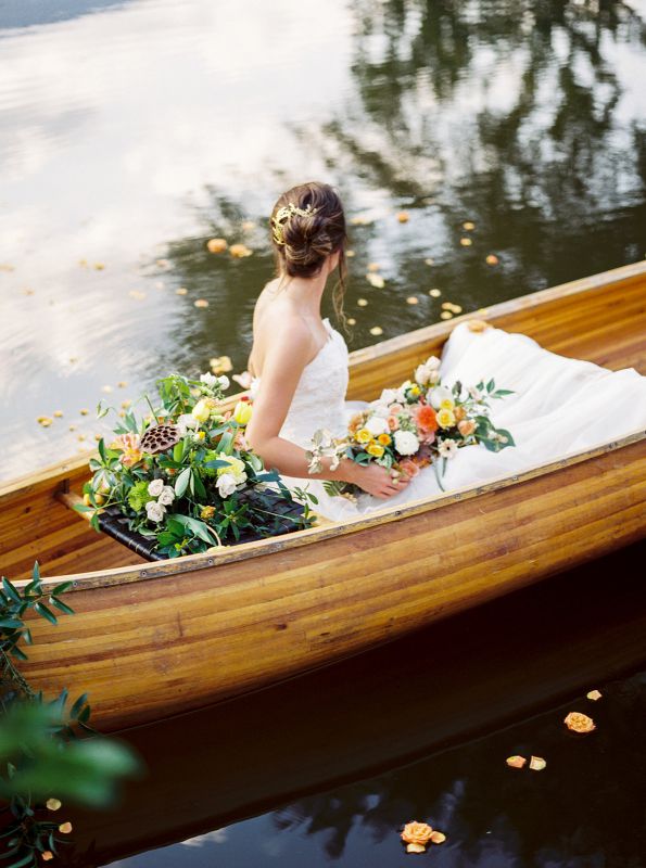 bride sitting in a canoe