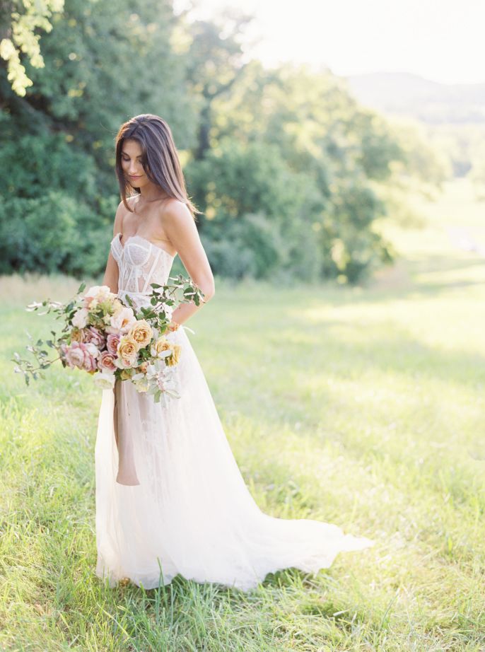 bride in white wedding dress with bouqet