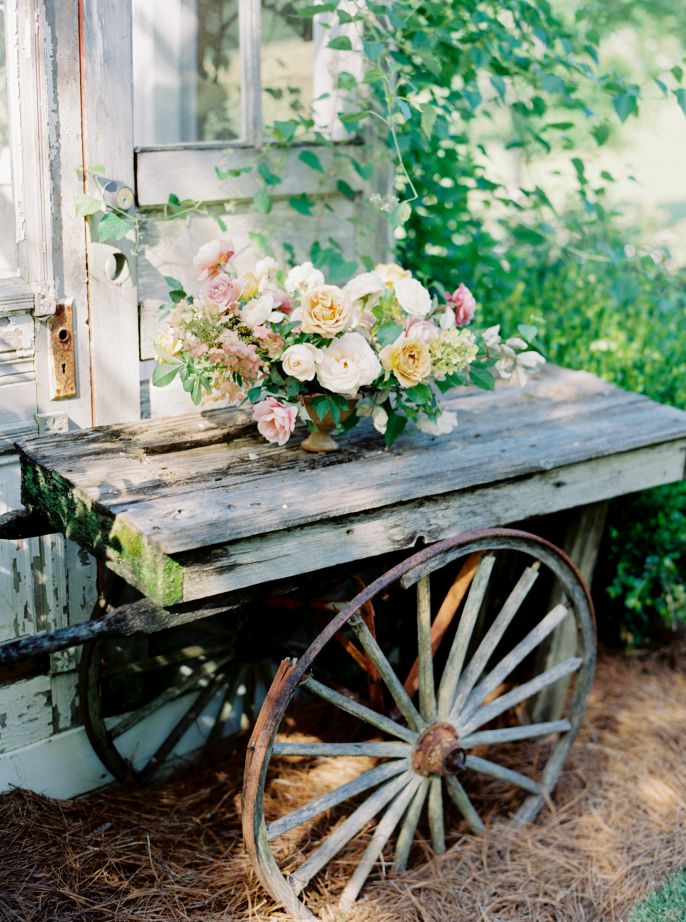 bridal bouqet sitting on old cart