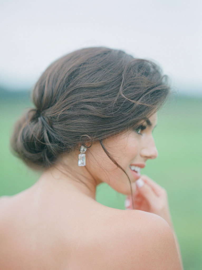 natural bridal hair styling and diamond earrings