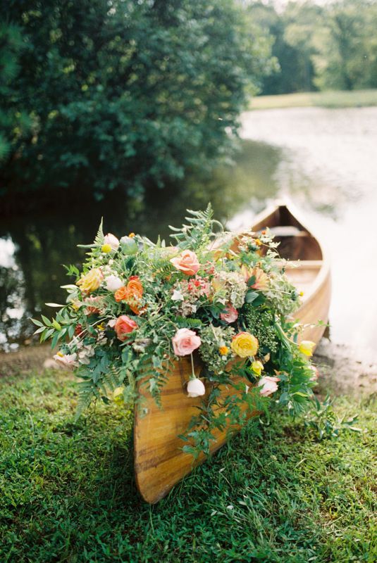 bridal bouquet resting on a canoe