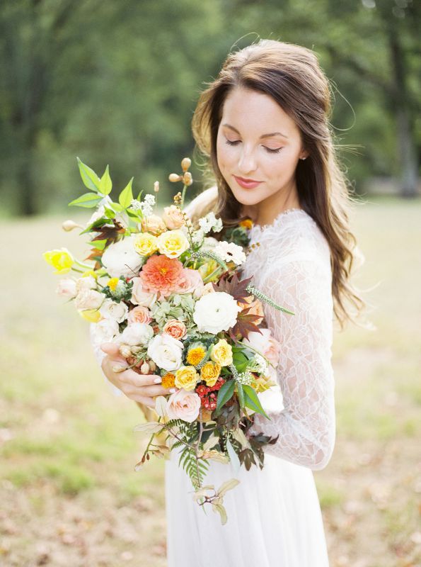 bride holding bouquet with natural makeup and hair down
