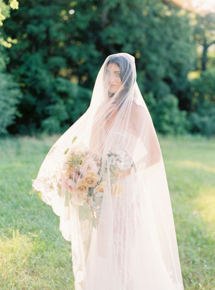 bride draped in her veil