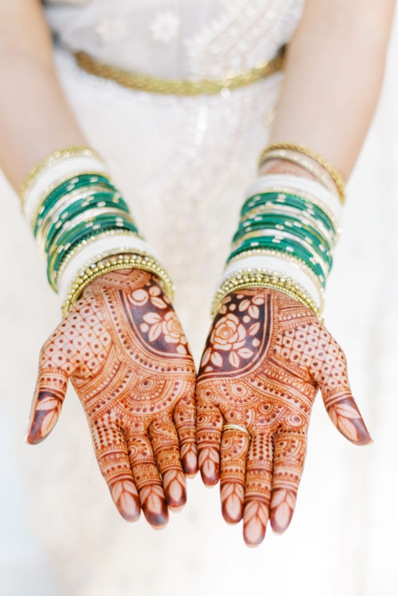 Indian henna tattoos and bracelet jewelry on the bride